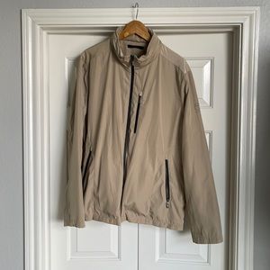 Tumi lightweight and stylish jacket, perfect for travel. Folds inside bag